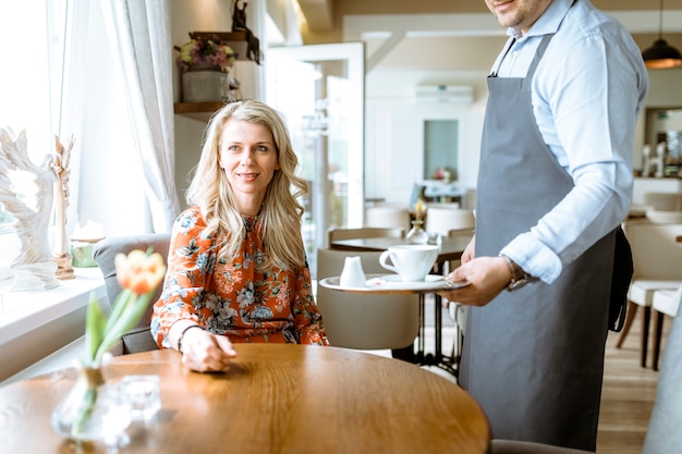 Free photo barman serving coffee