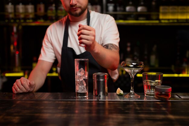 bartender making a delicious refreshing cocktail