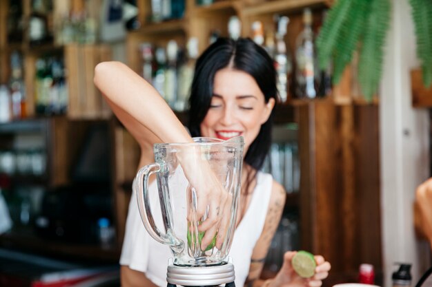 Bartender mixing cocktail