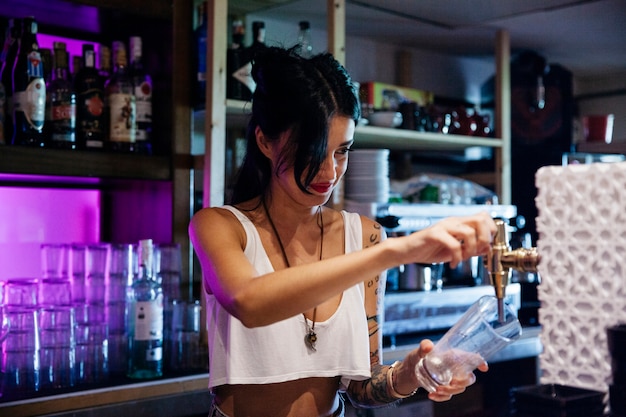 Bartender pouring a beer