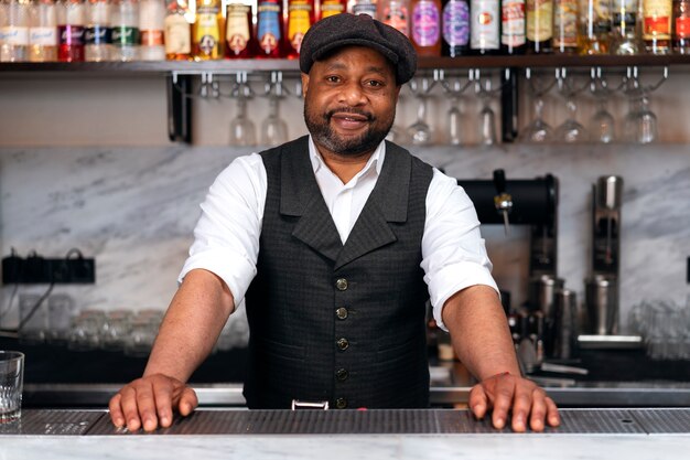 Bartender preparing drink at bar