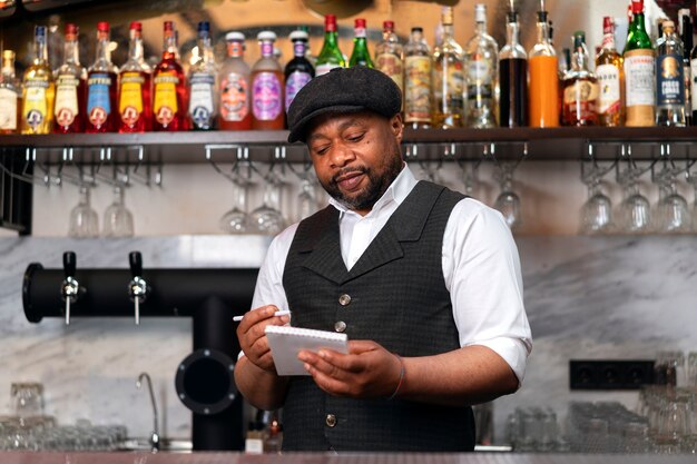 Bartender preparing drink at bar