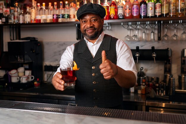 Bartender preparing drink at bar