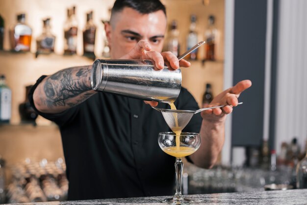 Bartender preparing a refreshing cocktail