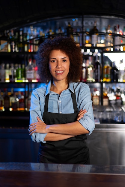 Free photo bartender working in a club