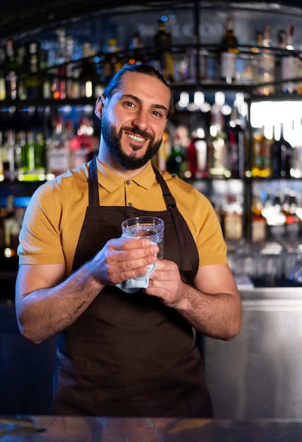 Free photo bartender working in a club