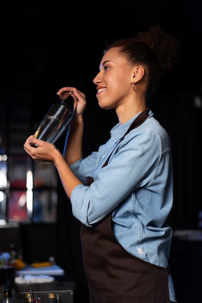 Free photo bartender working in a club