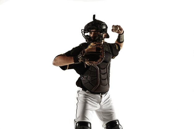 Baseball player in a black uniform practicing and training isolated on a white background