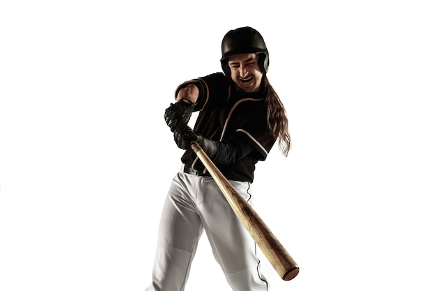 Baseball player in a black uniform practicing and training isolated on a white background