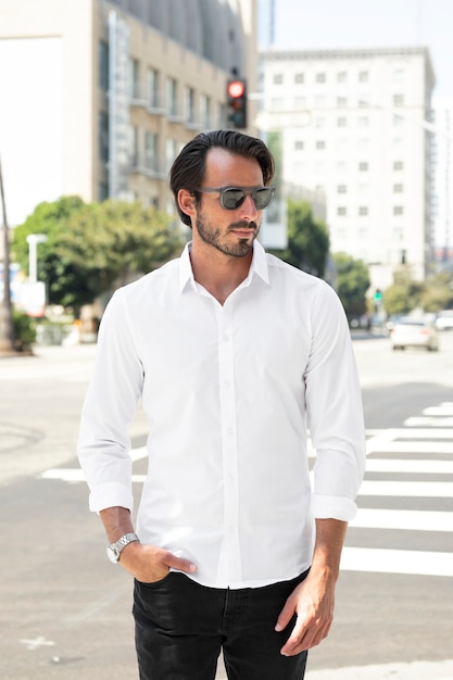 Free photo basic white shirt men’s fashion apparel city view shoot