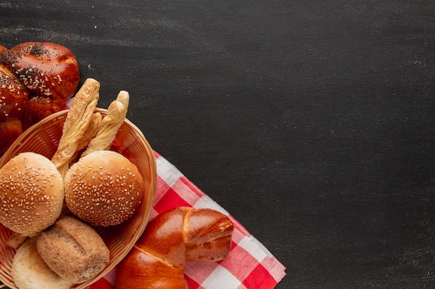 Basket of pastries on tablecloth