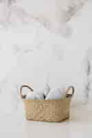 Free photo basket on table with marble backgrount and copy space