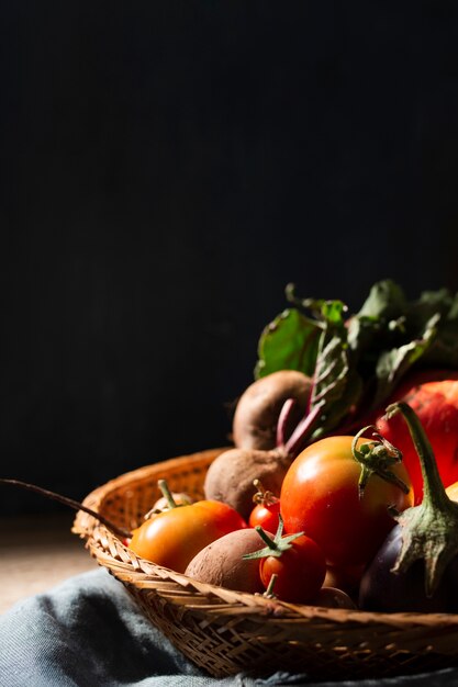 Basket with organic tomatoes and radishes