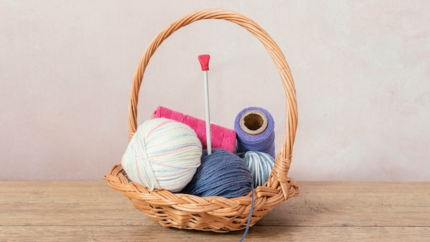 Basket with wool and knitting needles