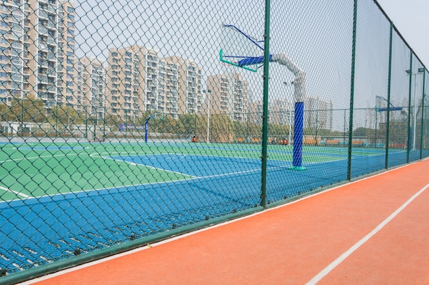 Basketball court with a wire fence around