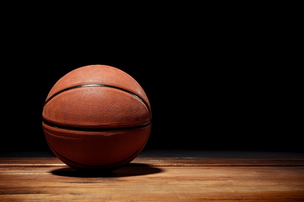 Basketball on a hardwood court floor