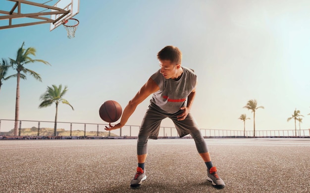 Basketball player in action on sunset