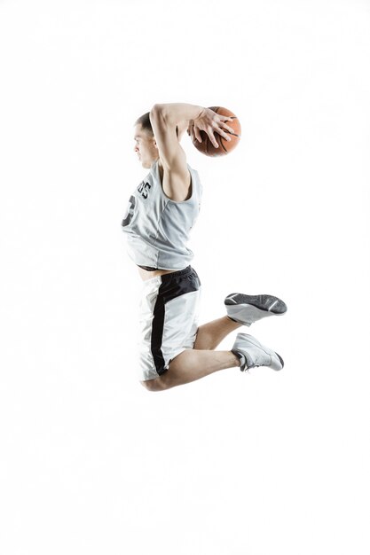 Basketball player jumping with the ball