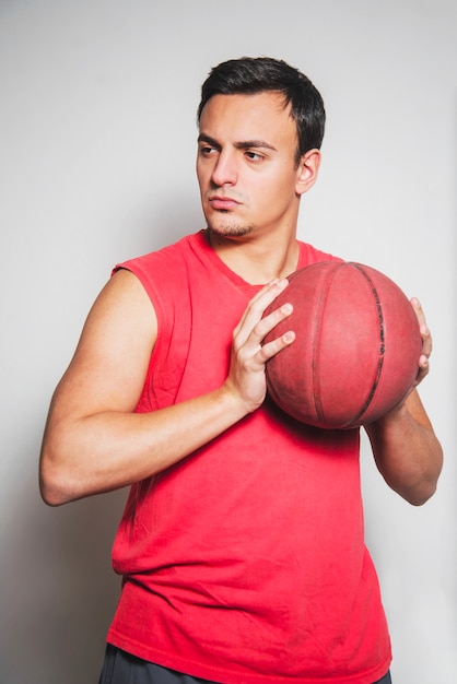 Basketball player posing with ball