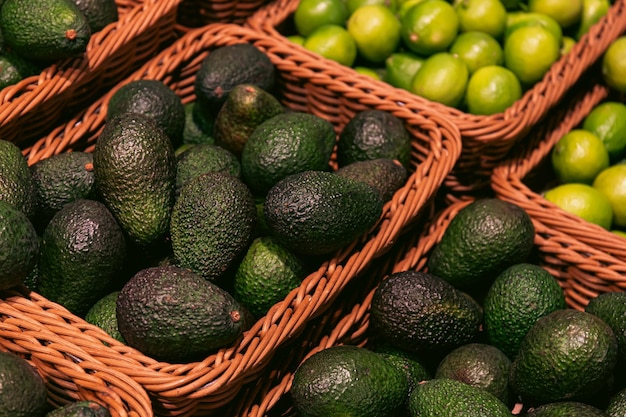 Baskets with avocado in a supermarket close up