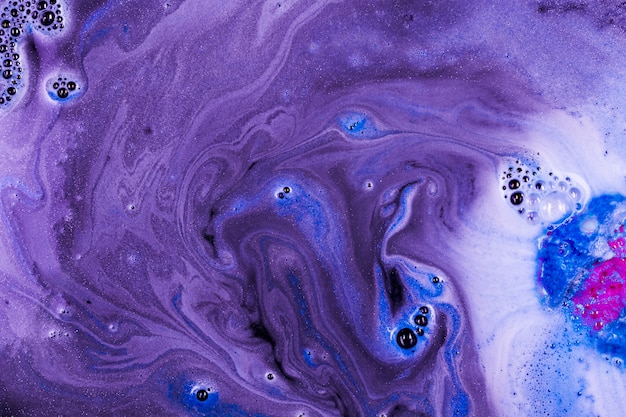 Bath bomb in purple water