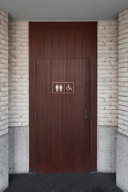 Bathroom signs on wooden door