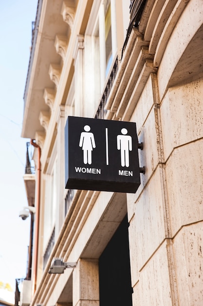 Free photo bathroom symbols outdoors low angle