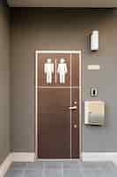 Free photo bathroom symbols on wooden door