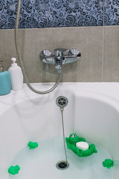 Bathtub with toys and soap