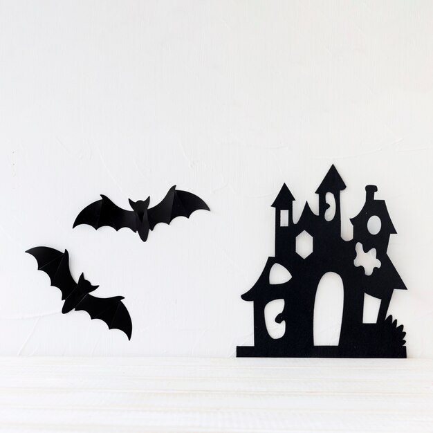 Bats and paper castle on wall