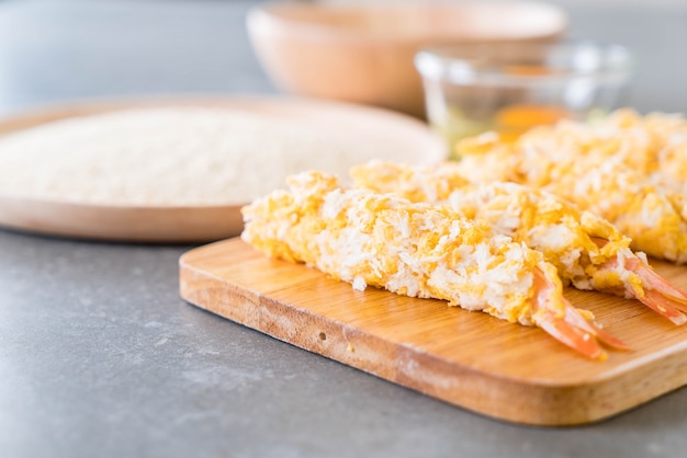 batter-fried prawns on wood board