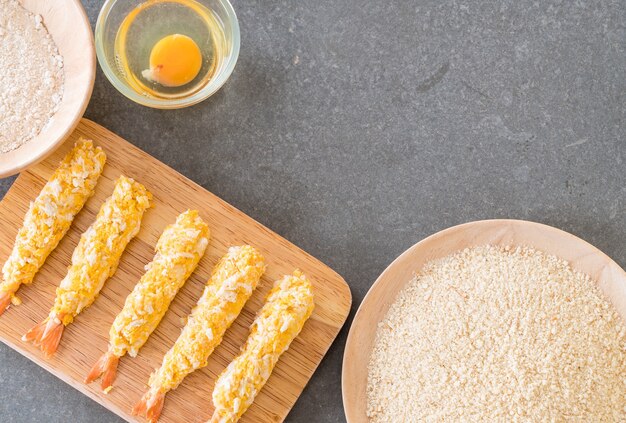 batter-fried prawns on wood board