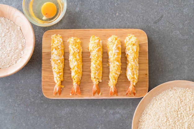 batter-fried prawns on wood board