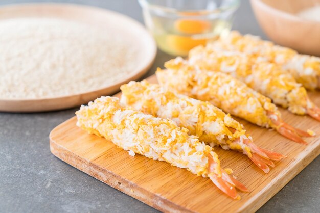 batter-fried prawns on wood board