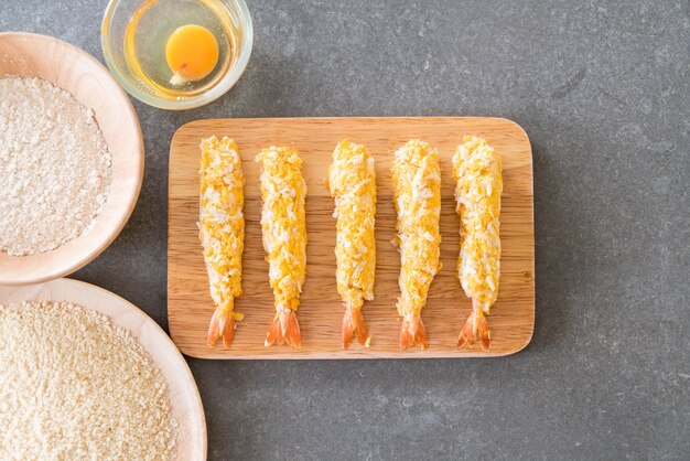 batter-fried prawns on wood board