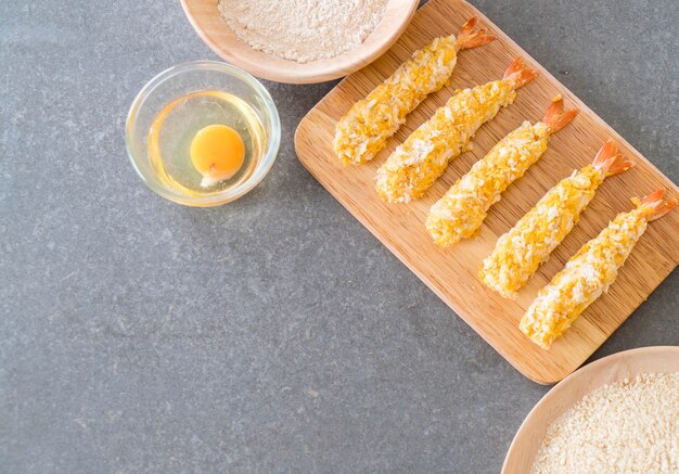 batter-fried prawns on wood board