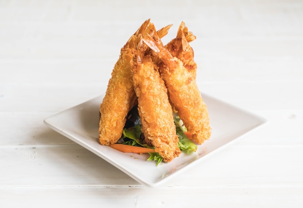 batter-fried prawns on wood