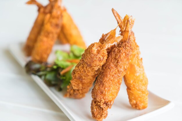 batter-fried prawns on wood