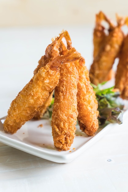 batter-fried prawns on wood