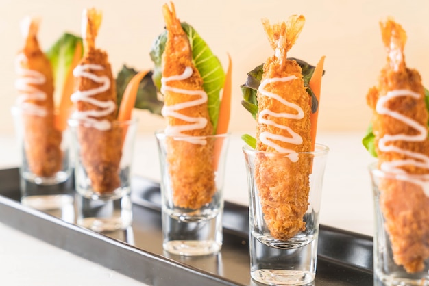 batter-fried prawns on wood