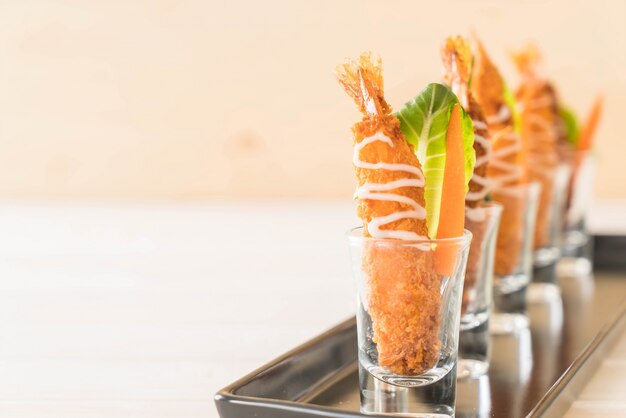 batter-fried prawns on wood