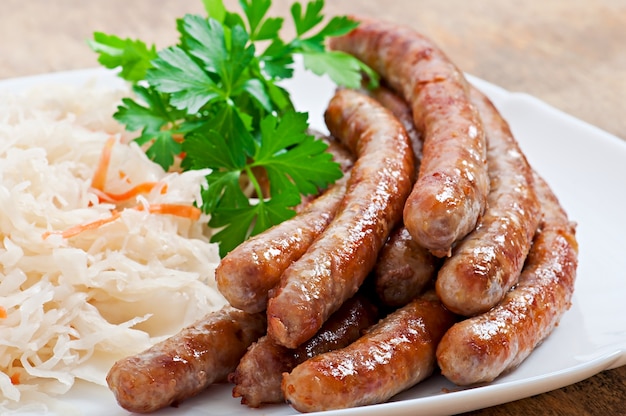 Bavarian fried sausages on sauerkraut