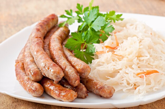 Bavarian fried sausages on sauerkraut