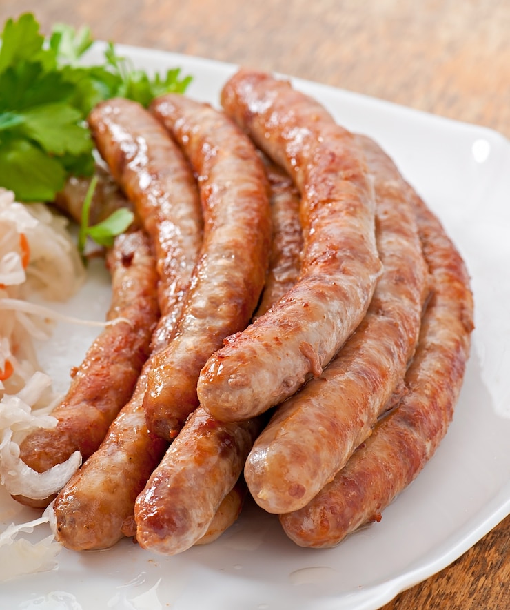 Free Photo bavarian fried sausages on sauerkraut
