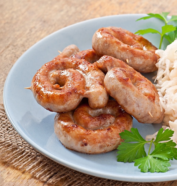 Bavarian fried sausages on sauerkraut