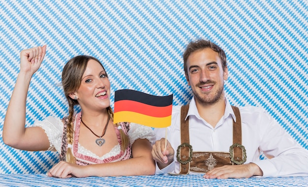 Bavarian friends holding german flag