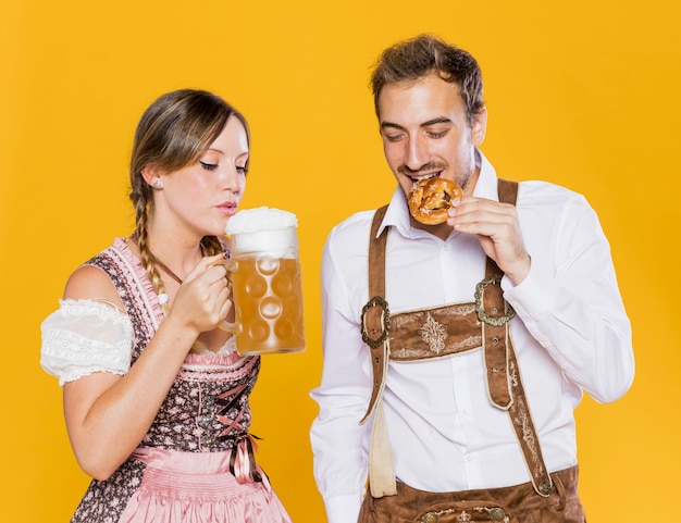 Bavarian friends trying oktoberfest snacks