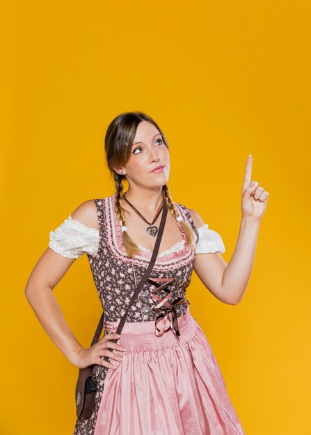Bavarian woman pointing up 