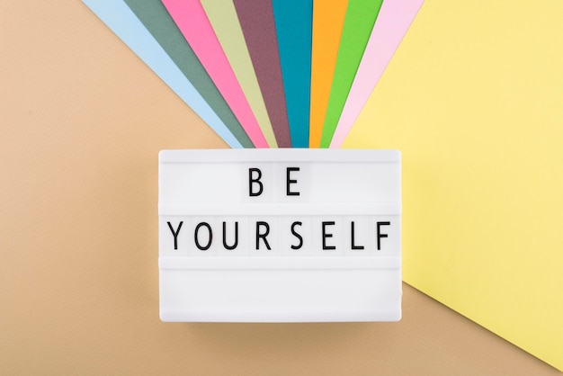 Be yourself message on lightbox arrangement