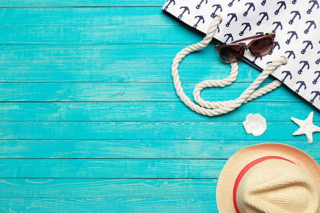 Beach accessories on wooden table.